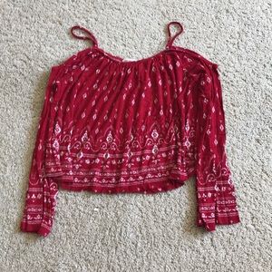 Red tribal top, with open shoulders.